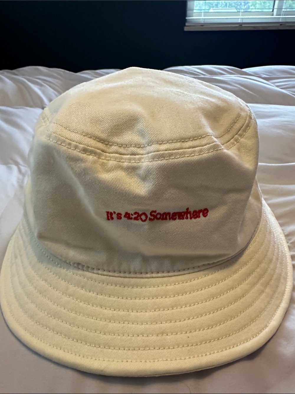 White mens Bucket Hat with Red Embroidered Text